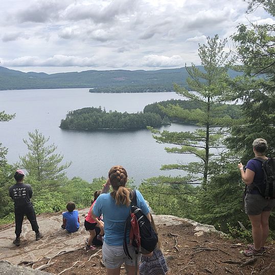 Hikers looking out over Newfound Lake