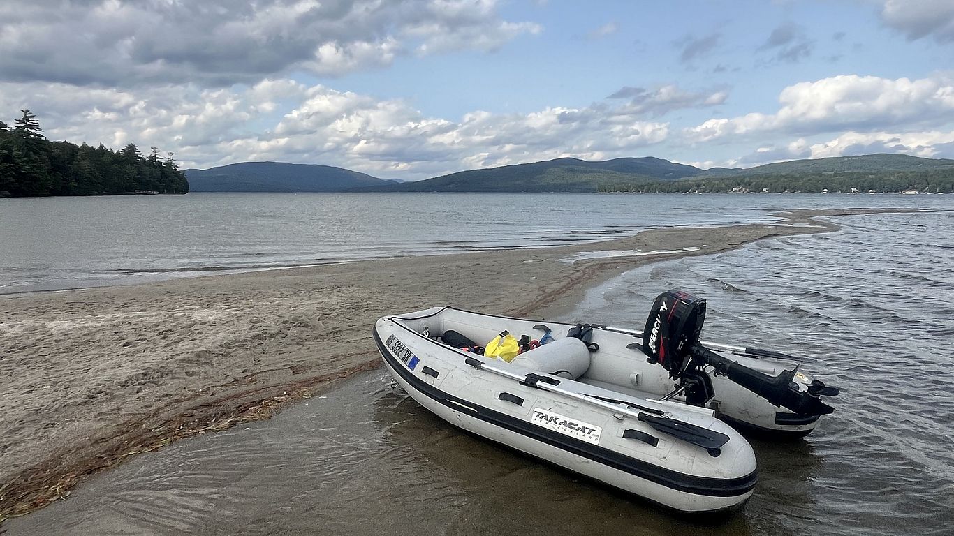 A boat pulled up on the shores of Newfound Lake.