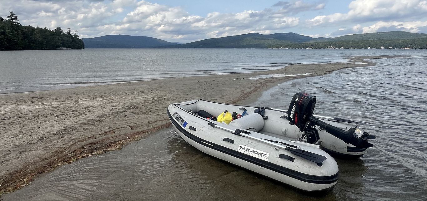 A boat pulled up on the shores of Newfound Lake.