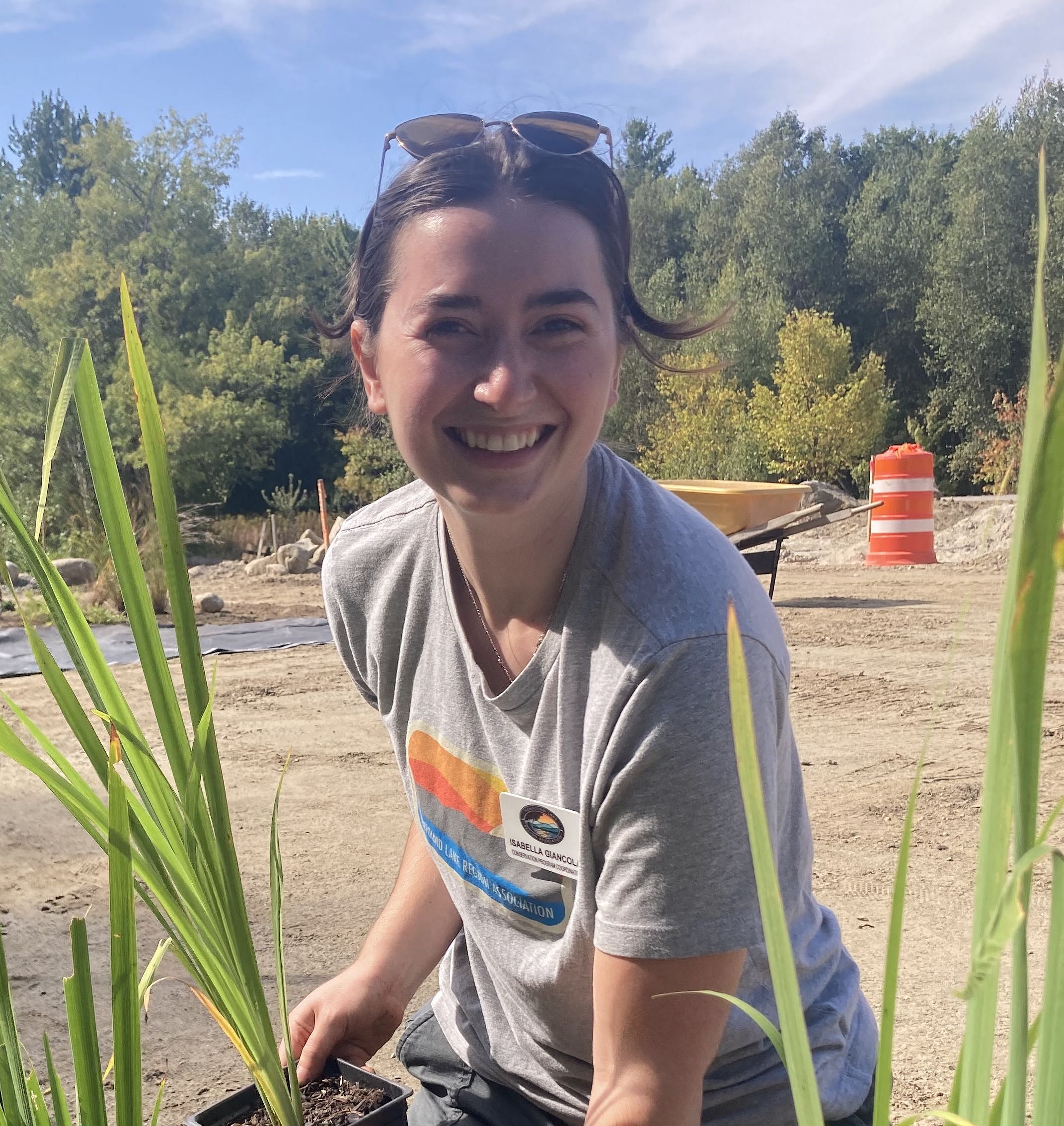 A volunteer working in a native plant garden.