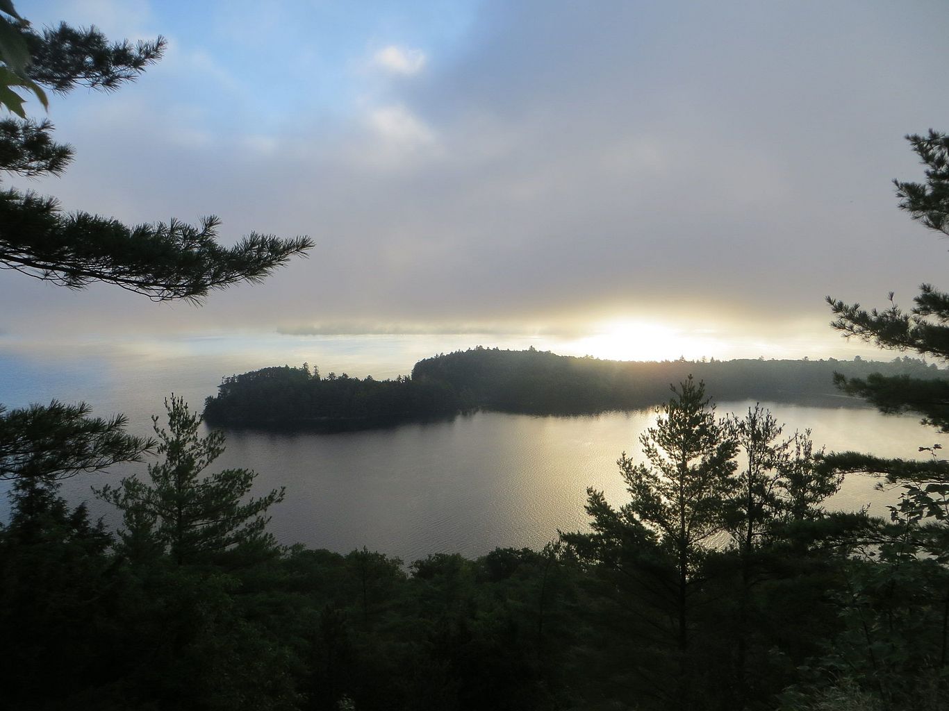 sun setting over lake